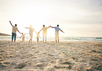 Image showing Family, generations and back view on the beach, travel and tropical vacation with freedom and sunshine. People outdoor, grandparents and parents with young kids, adventure and happiness in nature