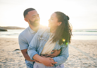 Image showing Hug, beach and couple with love, vacation and marriage with happiness, summer holiday and relax. Romance, happy man and woman embrace, seaside and lens flare with relationship, sunset and adventure