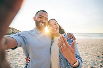 Image showing Beach, selfie and couple with engagement ring, happy portrait and celebration of love for social media. Live streaming, video call and excited woman and man for marriage and life together by ocean