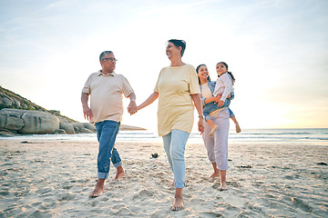 Image showing Grandparents, mother and child, generations and holding hands on the beach, travel and tropical vacation. People outdoor, man with women and young girl, adventure and smile in nature with trust