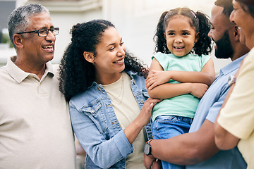 Image showing Family, grandparents and parents with kid outdoor, happiness and bonding at holiday home. Love, care and smile, men and women with young girl on lawn of house, summer vacation and relax in garden