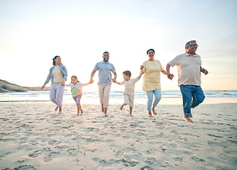 Image showing Trust, family and walking with holding hands on beach with freedom with care on vacation with sunshine. Love, children and generations or parents at ocean together for travel with bonding in summer.