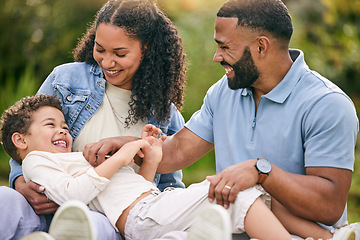 Image showing Tickle, relax and happy with family in garden for playful, bonding and love. Happiness, relax and smile with parents and child playing in backyard of home for free time, care and laughing together