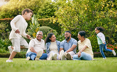 Image showing Picnic, playing children and happy family relax, have fun or enjoy outdoor quality time together, nature and wellness. Summer freedom, grass and bonding grandparents, parents and kids running in park