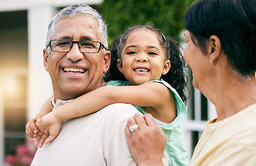 Image showing Grandparents, child and piggyback, happiness and hug with love, young girl with old man and woman outdoor. Relax, smile and trust, care and happy family, people on lawn of holiday home with fun