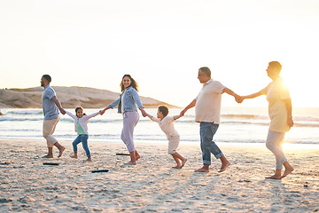 Image showing Love, family walking and holding hands on beach in summer for vacation with sunshine or sea. Holiday, generations and kid or parents together at ocean for travel with trust for bonding with freedom.