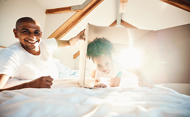 Image showing Portrait, box and father with girl in new home on bed, bonding and play in property with lens flare. Real estate, bedroom and dad with child, happy and relax in apartment, house and moving together.