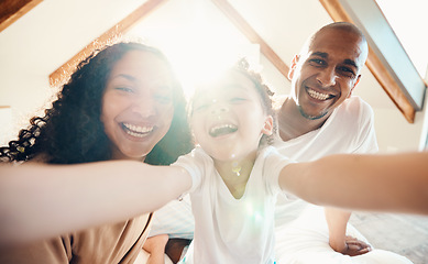 Image showing Family, funny and face selfie in house, bonding and laughing together with sunshine lens flare. Portrait, happy or girl with father, mother and parents with profile picture for memory on social media