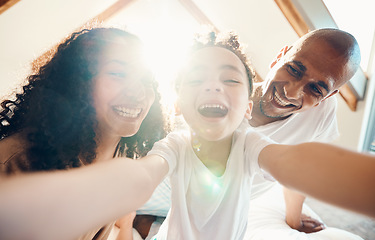 Image showing Funny, family and face selfie in home, bonding and laughing together with lens flare. Portrait, happy and girl with father, mother and parents taking profile picture for memory, social media and love