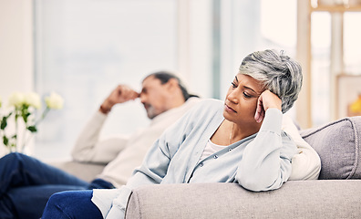 Image showing Senior couple, divorce and fight on sofa in conflict, argument or disagreement in living room at home. Elderly man and woman in stress, depression or toxic relationship for cheating affair or breakup