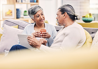 Image showing Conversation, tablet and mature couple networking on social media, mobile app or internet on a sofa. Communication, love and senior man and woman browsing on digital website in living room at home.