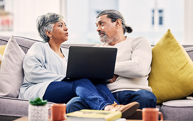 Image showing Laptop, planning and senior couple on a sofa for streaming, sign up or subscription discussion in their home. Retirement, relax and old people on online in a living room for internet, movie or search