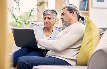 Image showing Planning, laptop and senior couple on a sofa for streaming, sign up or subscription discussion in their home. Retirement, relax and old people online in a living room for internet, movie or search