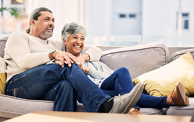 Image showing Senior couple on couch, laughing and watching tv at home, bonding and love with marriage and time together. Happiness, people relax in lounge and streaming comedy movie, retirement and life partner