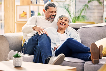 Image showing Home, funny and senior couple on a couch, love or relax with quality time marriage and romance. Romantic, old woman and mature man on a sofa, relationship or happiness with conversation and wellness