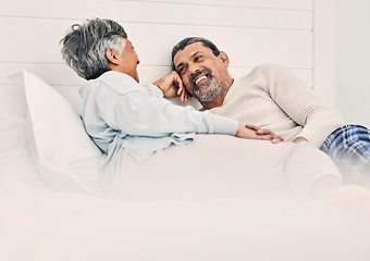 Image showing Love, relax and a senior couple in bed together, bonding in the morning while enjoying retirement in their home. Happy, conversation and an old man with his wife in the bedroom while on holiday