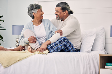 Image showing Old couple in bedroom together, hug with love and comfort, morning routine and happiness with bonding at home. Retirement, relax and communication, marriage and life partner with people in bed