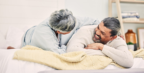 Image showing Lying, funny or old couple in bedroom to relax, enjoy romance or morning time together at home. Hugging, silly senior woman or happy elderly man laughing or bonding with love or smile in retirement