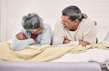 Image showing Laughing, talking or old couple in bedroom to relax, enjoy conversation or morning together at home. Speaking, happy senior woman or funny elderly man bonding with love, joke or smile in retirement