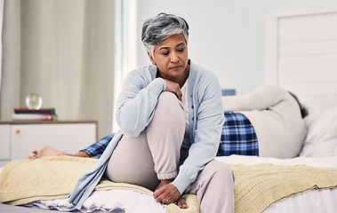 Image showing Sad, divorce and senior woman in bedroom with depression about infidelity in marriage with fight. Marriage, angry and elderly woman with anxiety or frustrated with problem in home with stress.