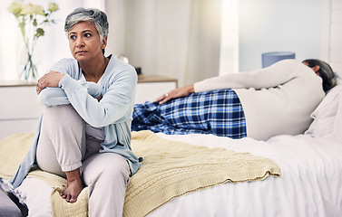 Image showing Senior woman, divorce and sad in bedroom with depression or frustrated in marriage with infidelity. Fight, anxiety and elderly woman with problem in home or bed with problem and stress or angry.