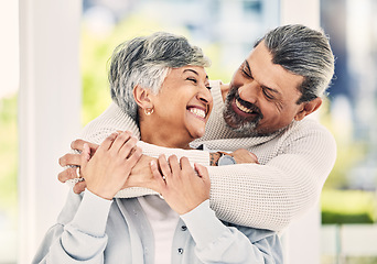 Image showing Hug, home and senior couple with love, smile and retirement with happiness, quality time or loving together. Old woman, happy mature man or embrace in a lounge, bonding or romance with a relationship