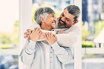 Image showing Hug, marriage and senior couple with love, smile and retirement with happiness, home and bonding. Old woman, happy mature man and embrace in a lounge, loving together and romance with a relationship