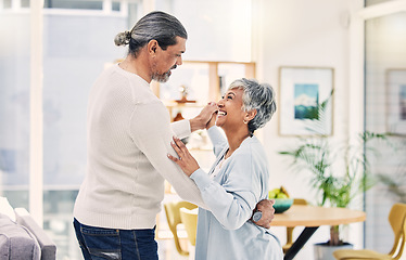 Image showing Senior couple, holding hands and dancing in living room for love, care or bonding together at home. Happy elderly man and woman enjoying quality time, weekend or holiday celebration for anniversary