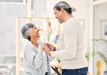 Image showing Laughing, holding hands or old couple dancing in living room for love, care or joy bonding together at home. Happy, elderly man or senior woman in celebration for anniversary or romance in retirement