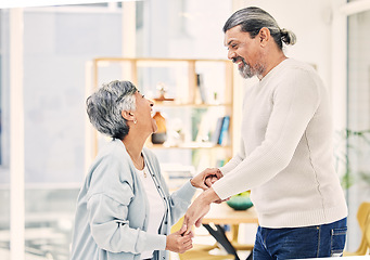 Image showing Happy, holding hands or old couple dancing in living room for love, care or joy bonding together at home. Smile, elderly man or senior woman in celebration for anniversary or romance in retirement