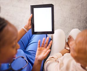 Image showing Nurse, caregiver and tablet mockup with patient above for consultation or healthcare advice at the home. Hands of doctor in elderly care consulting senior female person on technology display in house
