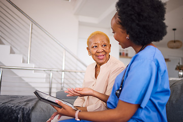 Image showing Health support, nurse and a black woman with a tablet for medical information or advice online. Smile, conversation and an African nurse helping a senior patient with healthcare on an app in a house