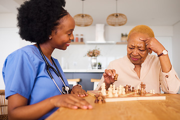 Image showing Black people, nurse and thinking in elderly care for chess, fun or social activity together at home. African medical professional playing strategy board game with senior female person in the house