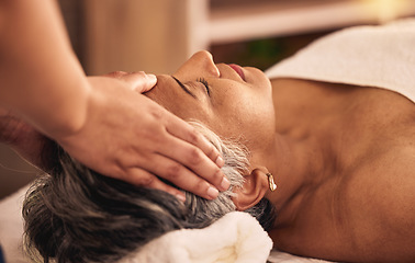 Image showing Woman, facial and head massage at spa for beauty, skincare treatment and healing at cosmetics salon. Face of calm mature female client relax at wellness resort for reiki, acupressure and zen therapy