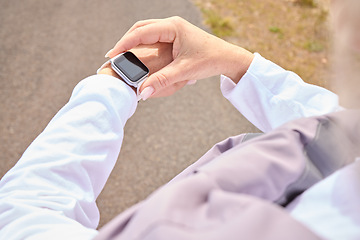 Image showing Runner hands, smart watch and road with check, progress and tech for fitness, heart or speed in summer. Woman, running and iot clock for stats, health and data for exercise, wellness or app on street