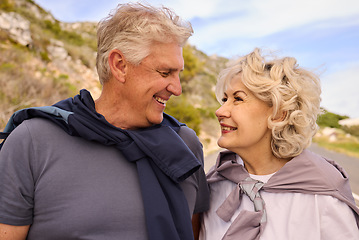 Image showing Senior couple, smile and love for fitness, outdoor or nature for motivation, wellness or exercise. Elderly man, woman and romantic eye contact with bonding, training or workout in mountain for health
