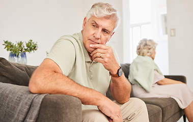 Image showing Senior man, fight and thinking of divorce, breakup and stress of sad separation on sofa at home. Frustrated couple on couch in conflict, crisis and problem of drama, bad marriage or emotional anxiety