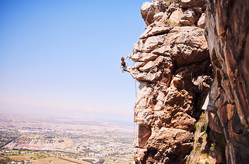 Image showing Sports, rock climbing and space with woman on mountain for fitness, adventure and challenge. Fearless, workout and hiking with person on training cliff for travel, freedom and exercise mockup