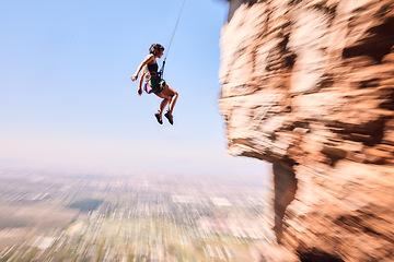 Image showing Sports, rock climbing and jump with woman on mountain for fitness, adventure and challenge. Fearless, workout and hiking with person training on cliff for travel, freedom and exercise mockup