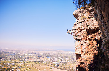 Image showing Nature, rock climbing and space with man on mountain for fitness, adventure and challenge. Fearless, workout and hiking with person training on cliff for travel, freedom and exercise mockup