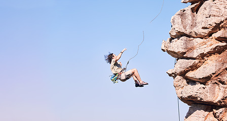 Image showing Jump, rock climbing and space with man on mountain for fitness, adventure and challenge. Rope, workout and hiking with person training on cliff in nature for travel, freedom and exercise mockup