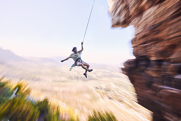 Image showing Sports, rock climbing and jump with man on mountain for fitness, adventure and challenge. Rope, workout and hiking with person training on cliff in nature for travel, freedom and exercise mockup