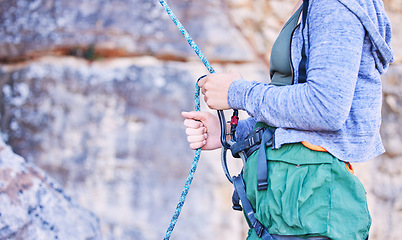 Image showing Rock climbing, mountain and hands of woman with rope for adventure, freedom and extreme sports. Fitness, outdoor and female person with safety equipment or gear closeup for training and challenge