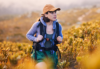 Image showing Mountains, hiking and woman in backpack for nature journey, travel and outdoor adventure with bush or plants. Young person from Australia search field, trekking and walking with fitness gear