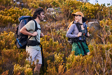 Image showing Hiking, travel and couple walking on mountain for adventure, holiday and journey in nature. Travel, dating and happy man and woman talking and explore, trekking and backpacking outdoors for wellness