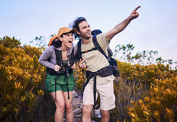 Image showing Hiking, pointing and excited couple in nature for adventure, holiday and journey on mountain. Travel, dating and man and woman walking with surprise and wow for view, trekking and backpacking outdoor