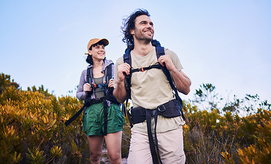 Image showing Hiking, travel and couple walking in nature for adventure, holiday and sightseeing journey on mountain. Fitness, dating and happy man and woman excited to explore, trekking and backpacking outdoors