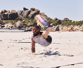 Image showing Sports, beach and man playing volleyball while jumping on the sand while on tropical weekend trip. Fitness, blur motion and young male athlete training for seaside game, match or tournament by ocean.