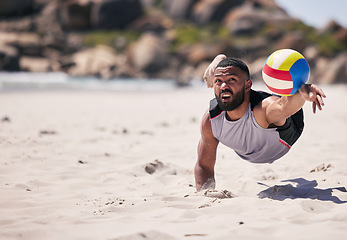 Image showing Fitness, beach and athlete playing volleyball while jumping on the sand while on tropical weekend trip. Sports, blur motion and young man training for seaside game, match or tournament by the ocean.