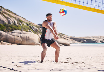 Image showing Beach, volleyball and man at net with sports action, fun and summer competition on sea sand. Energy, ocean games and volley challenge with athlete hitting ball for goal at fitness workout in nature.